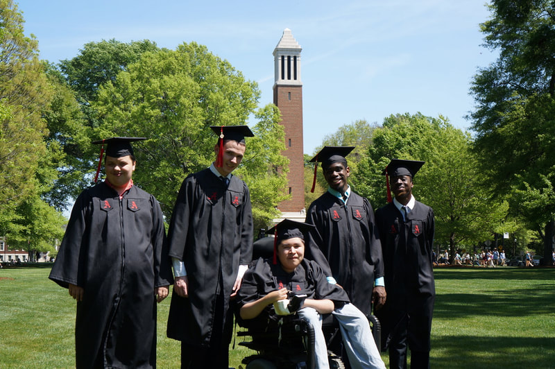 College graduates in front of Denny Chimes