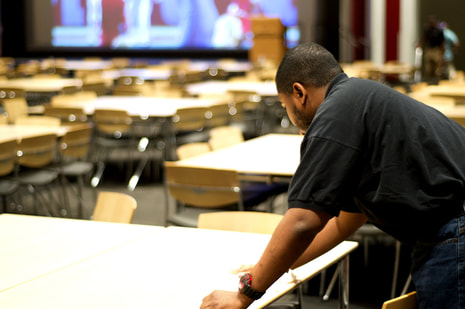 Guy wiping table