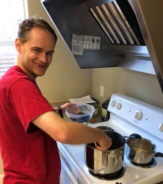 Man cooking on a stove