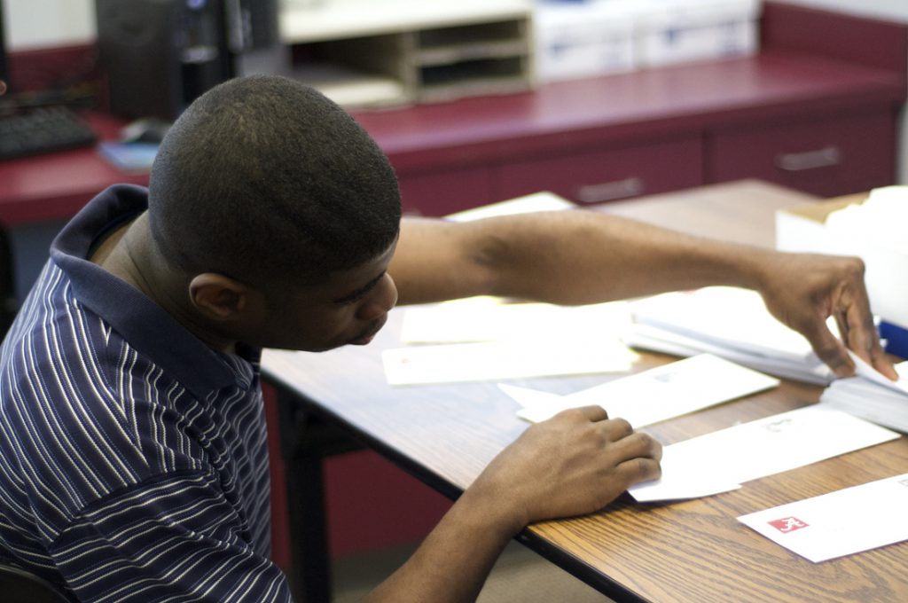 Man organizing papers