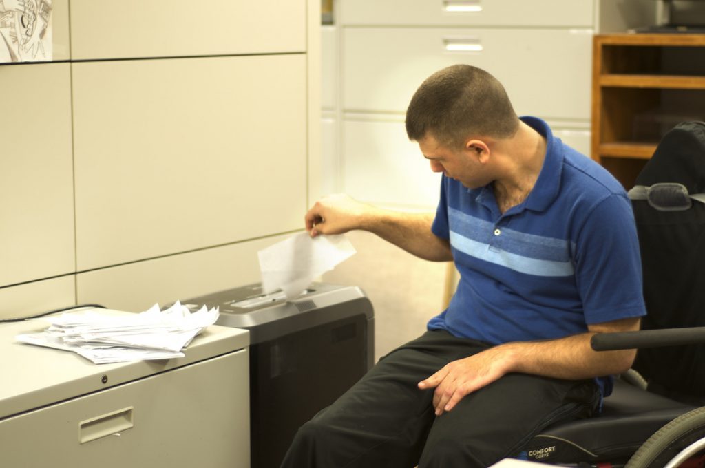 Guy shredding papers